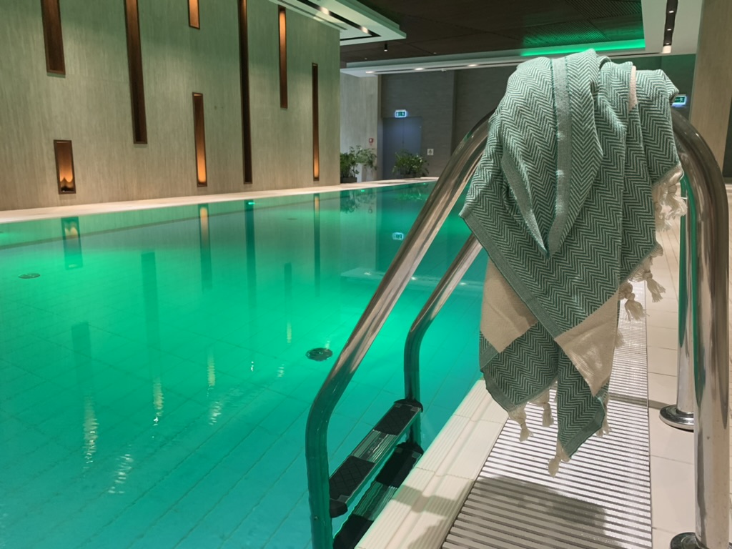 Peştemal by the spa pool — draped over the railing